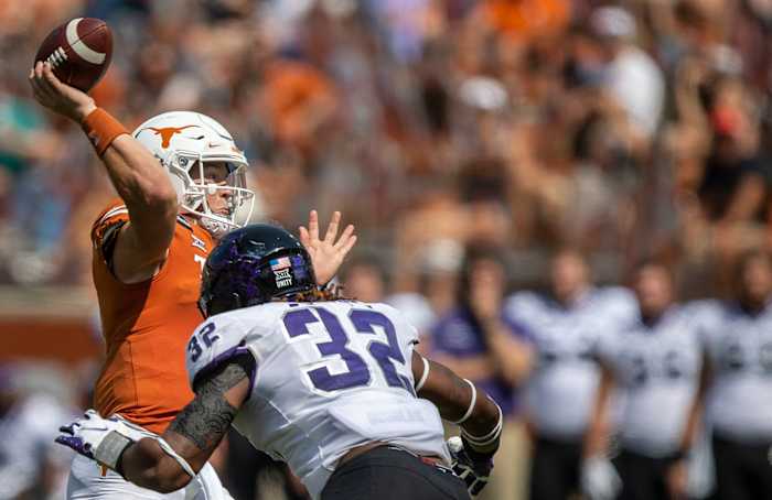 Oct 3, 2020; Austin, TX, USA; TCU Horned Frogs defensive end Ochaun Mathis (32) pressures Texas Longhorns quarterback Sam Ehlinger (11) in the 3rd quarter in a NCAA college football game at Darrell K Royal-Texas Memorial Stadium.